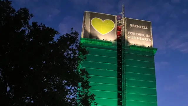 Grenfell Tower lit up in green