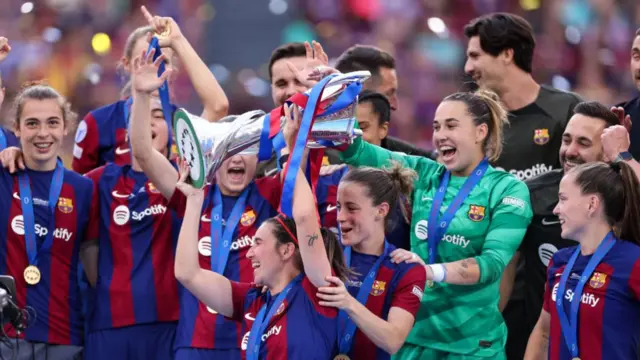 Winners Barcelona lift the Women's Champions League trophy in 2024