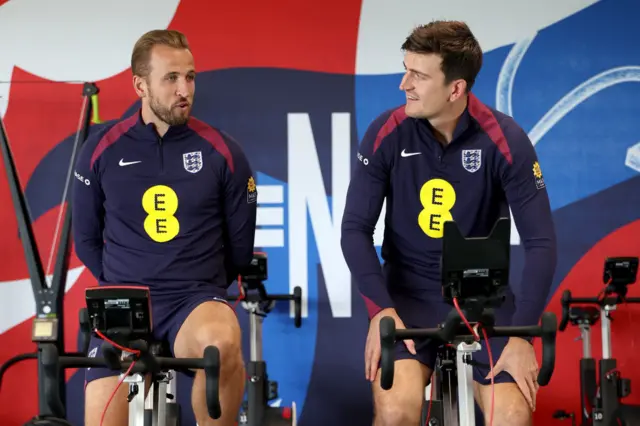 Harry Kane and Harry Maguire on exercise bikes during England training