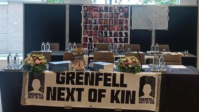 A Grenfell Next of Kin banner in a briefing room in the hotel