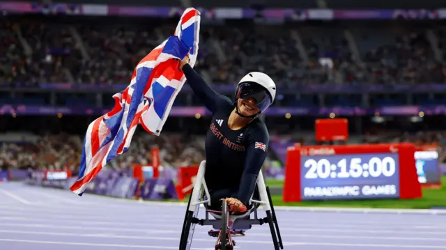 Sammi Kinghorn reacts to winning gold in women's T53 100m final