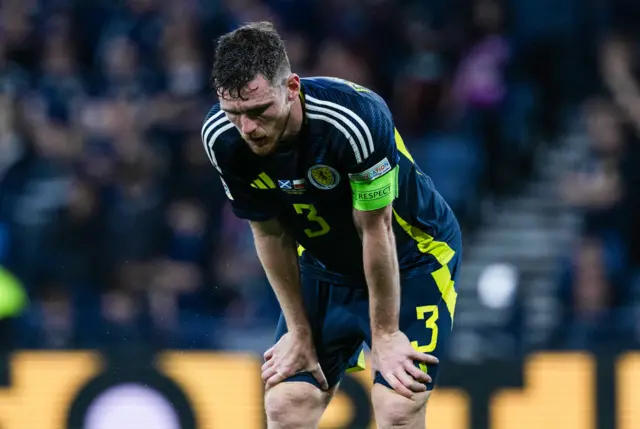 Dejected Andy Robertson