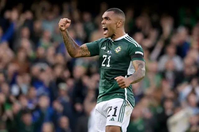 Josh Magennis celebrates