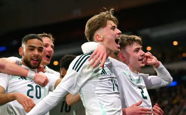 Northern Ireland celebrate a goal against Scotland