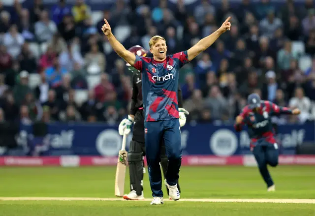 David Willey of Northamptonshire Steelbacks celebrates after taking the wicket of Will Smeed