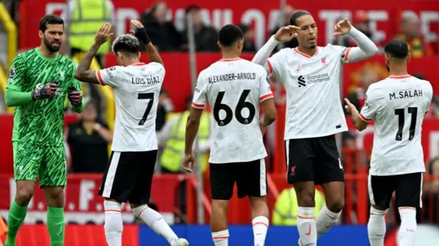 Liverpool players congratulate each other