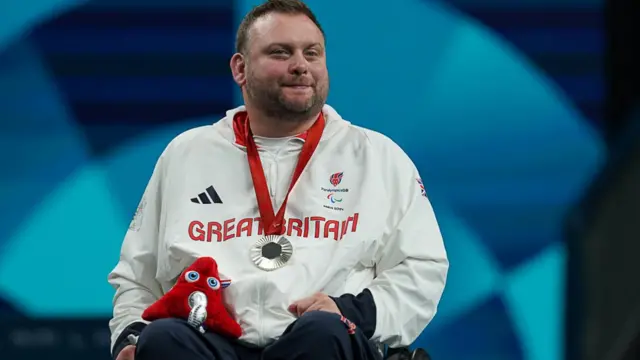 Rob Davies with his silver medal