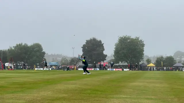 Mitch Marsh picks the ball out of the grey sky