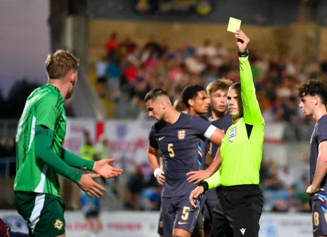 David Smajc showing a yellow card to JJ McKiernan