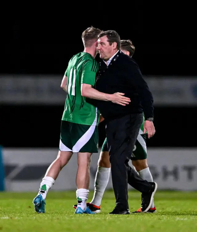 Terry Devlin embracing manager Tommy Wright after the 0-0 draw