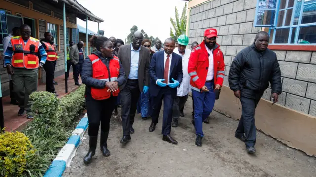 Kenya's Cabinet Secretary, Ministry of Interior and National Administration Kithure Kindiki walks with Kenya Red Cross Secretary General Idris Ahmed, at the Hillside Endarasha Academy,