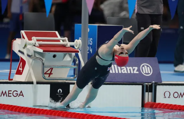 Maskill enters the pool on her back