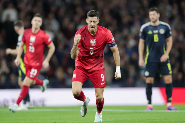 Robert Lewandowski celebrates against Scotland