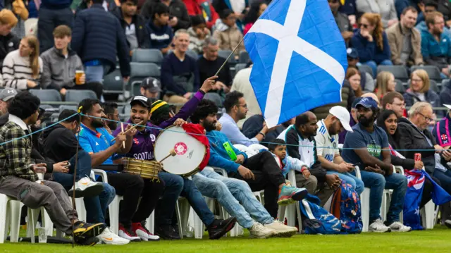 Scotland's biggest fans with their drums and tambourine