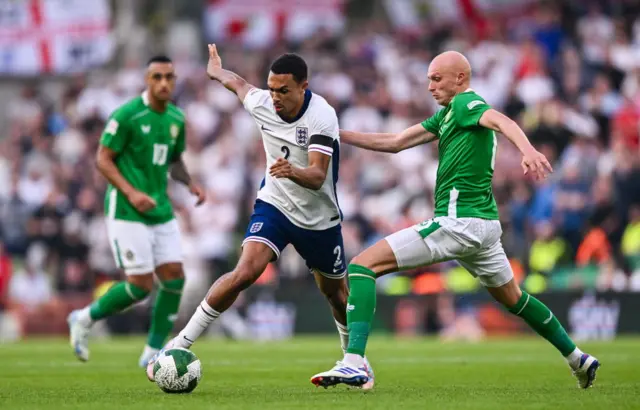 Trent Alexander-Arnold of England is tackled by Will Smallbone of Republic of Ireland