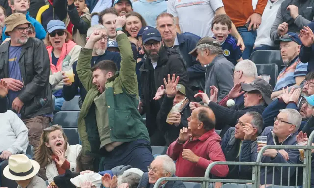 A fan drops a catch