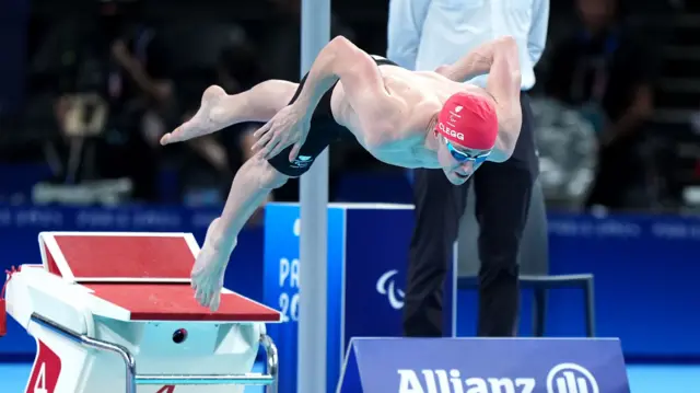 Stephen Clegg dives into the pool