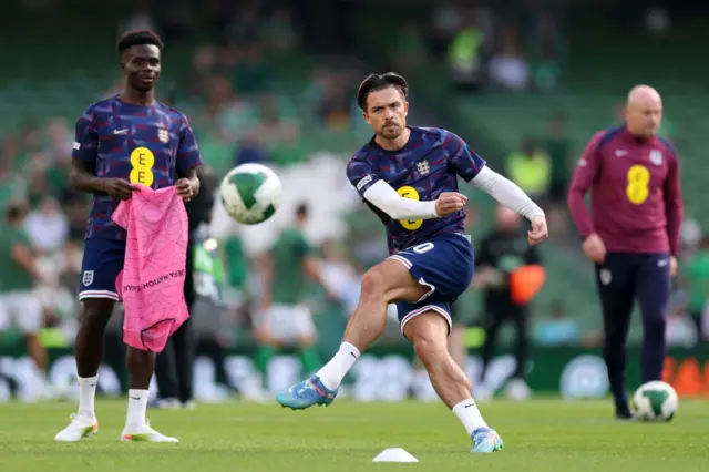 Grealish warms up with a shooting drill