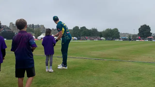 Aaron Hardie signs autographs