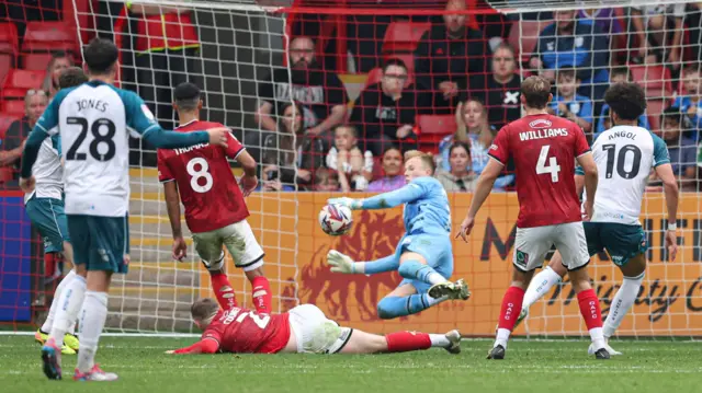 Crewe's Filip Marschall makes a save