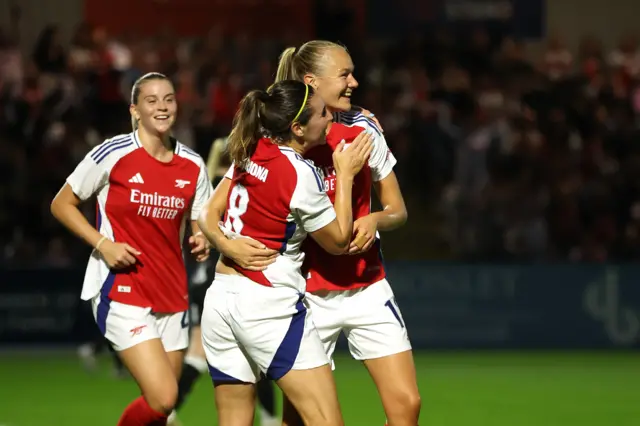 Arsenal players celebrate their goal