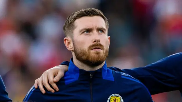 Scotland's Anthony Ralston during the national anthem during a UEFA Nations League match between Portugal and Scotland at the Estadio da Luz, on September 08, 2024, in Lisbon, Portugal. (Photo by Craig Williamson / SNS Group)