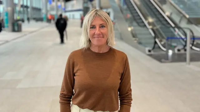 Sarah Brett standing in the station
