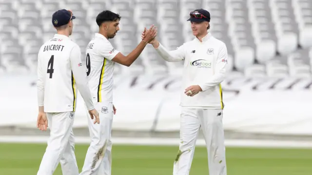 Gloucestershire celebrate the wicket of Jack Davies