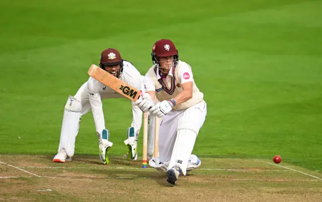 Archie Vaughan of Somerset plays a shot as Ben Foakes of Surrey keeps during Day One of the Vitality County Championship Division One match between Somerset and Surrey