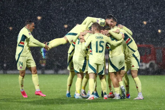 Wales celebrate their opening goal