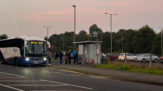 Passengers getting onto a bus in Omagh