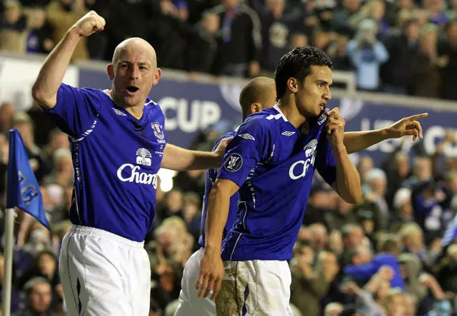 Tim Cahill (R) of Everton celebrates scoring with team mate Lee Carsley