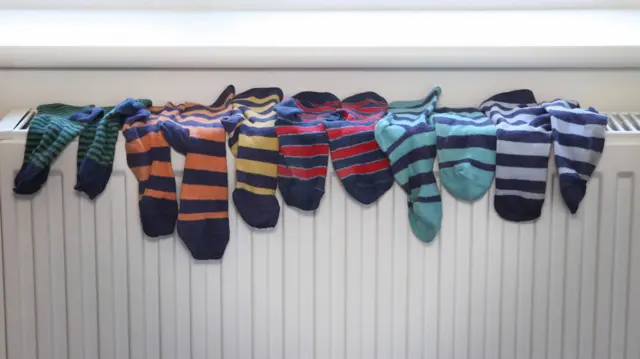 Socks drying on a radiator (stock photo)