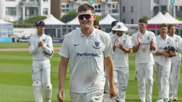 Jack Carson leads Sussex off after beating Derbyshire