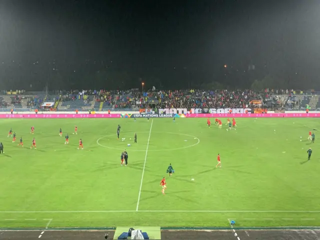 Montenegro fans holding a banner with Matija Sarkic’s name on.