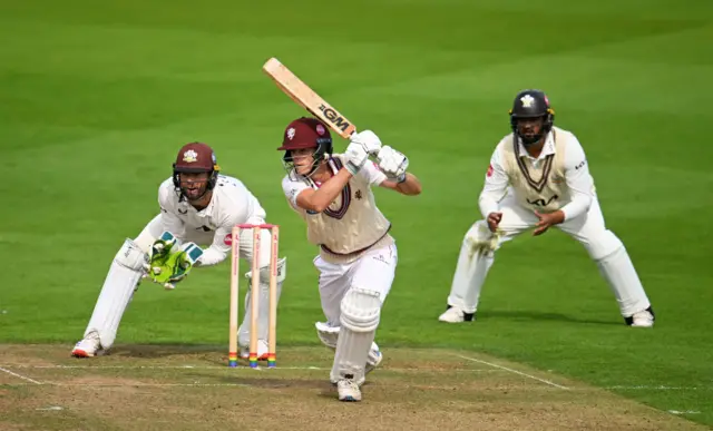 Archie Vaughan of Somerset plays a shot