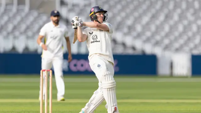 Jack Davies hits a six