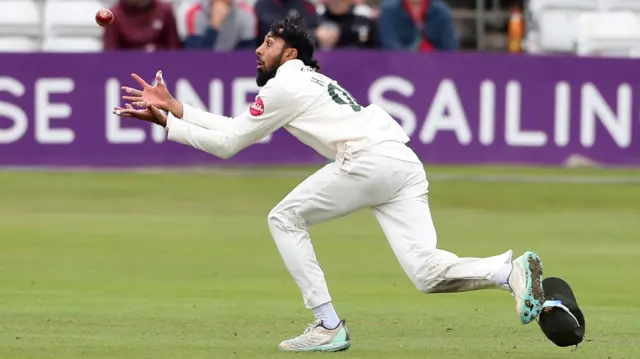 Haseeb Hameed of Nottinghamshire takes a catch to dimiss Dean Elgar during Essex CCC vs Nottinghamshire CCC