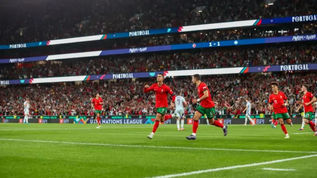 Cristiano Ronaldo and Portugal celebrate victory over Scotland