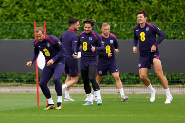 Harry Kane and teammates warm up