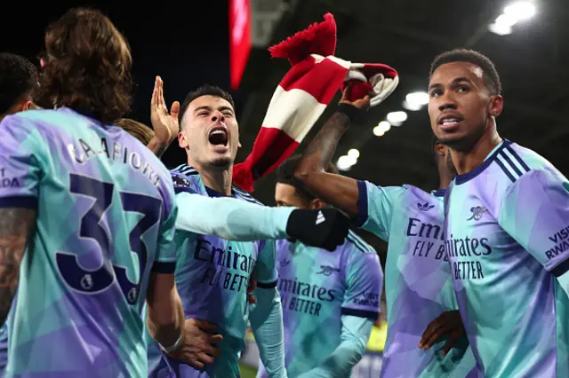 Gabriel Martinelli of Arsenal celebrates with Riccardo Calafiori and Gabriel
