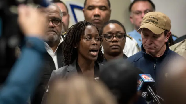 FBI special agent Alethea Duncan speaking at a news conference, stood to the right of Louisiana Governor Jeff Landry