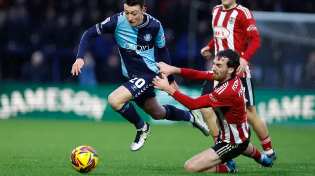 Wycombe and Exeter players in action