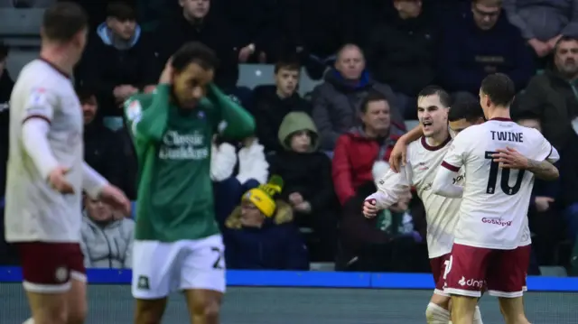 Anis Mehmeti celebrates opening the scoring for Bristol City at Plymouth
