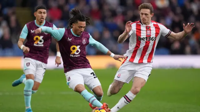 Burnley’s Luca Koleosho in action against Stoke City's Wouter Burger