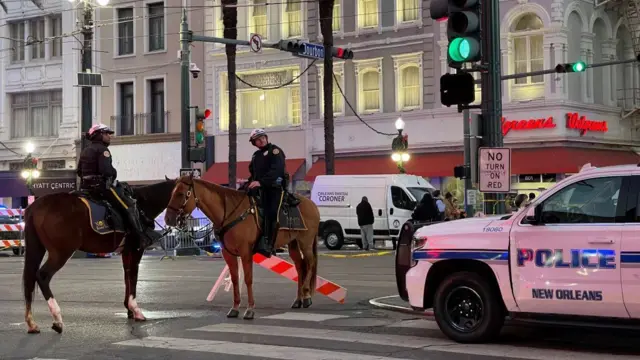 Two police on horses on a zebra crossing in New Orleans