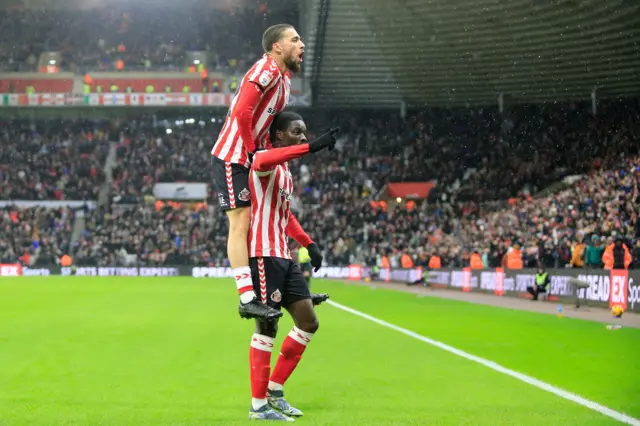 Eliezer Mayenda of Sunderland scores the opening goal and celebrates