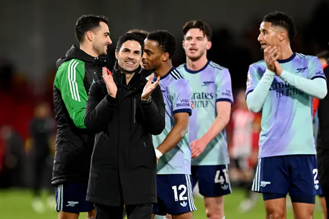 Mikel Arteta, Manager of Arsenal, acknowledges the fans