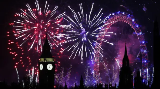 A fireworks display erupts over London during New Year's celebrations in London