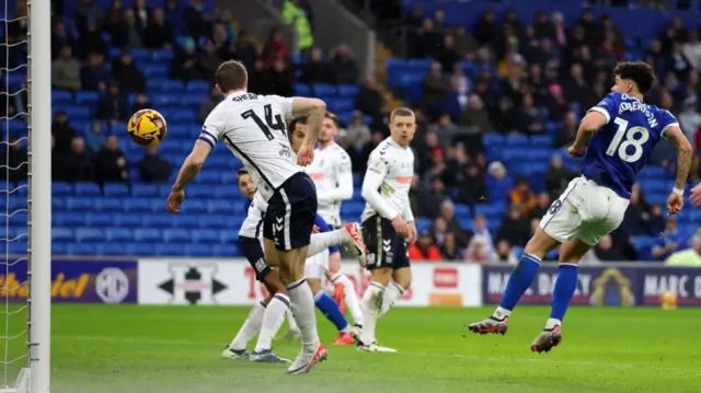 Alex Robertson heads Cardiff into the lead against Coventry